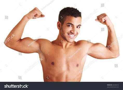 A Young Man Flexing His Biceps Muscles Stock Photo