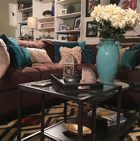 Your home, your rules… brogue leather and brass side table in teal grey, £3,240, boutique & t collection, bethan gray at harrods. Cozy brown couch with teal accents, turquoise and brown ...