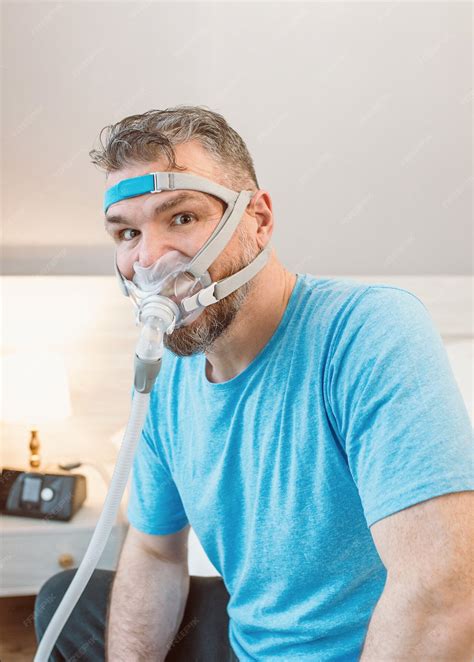premium photo unhappy shocked man with chronic breathing issues surprised by using cpap