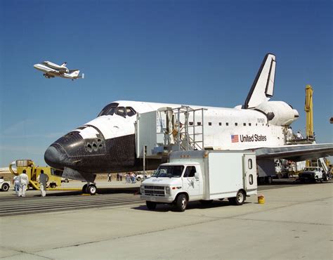 The Space Shuttle Endeavour Receives A High Flying Salute From Its