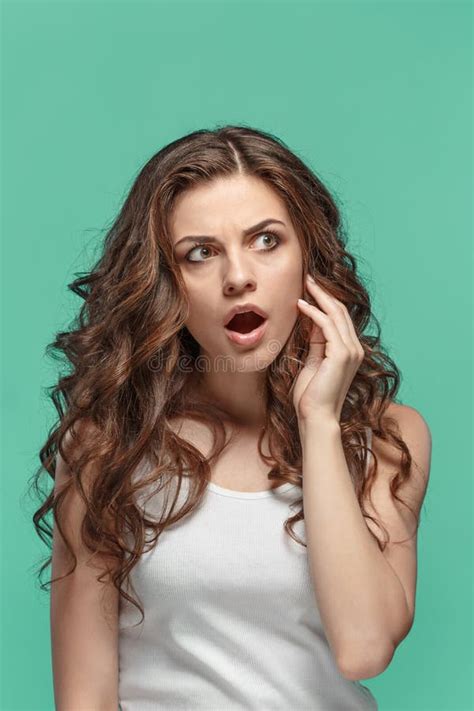 Portrait Of Young Woman With Shocked Facial Expression Stock Image