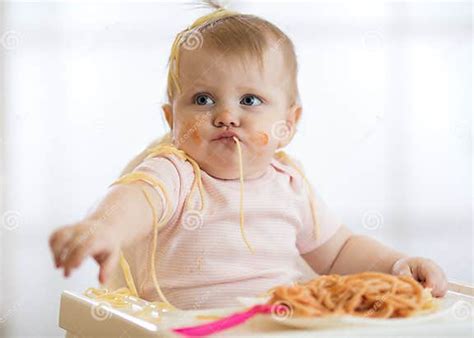 Adorable Little Baby One Year Eating Pasta Indoor Funny Toddler Child