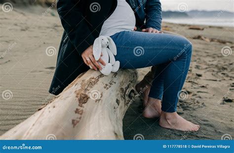 Pregnant On The Beach With Her Partner Stock Photo Image Of Pregnancy Embracing