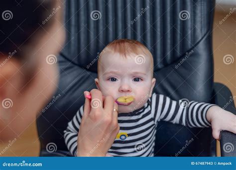Adorable Baby On Chair Eating Porridge Food Stock Image Image Of
