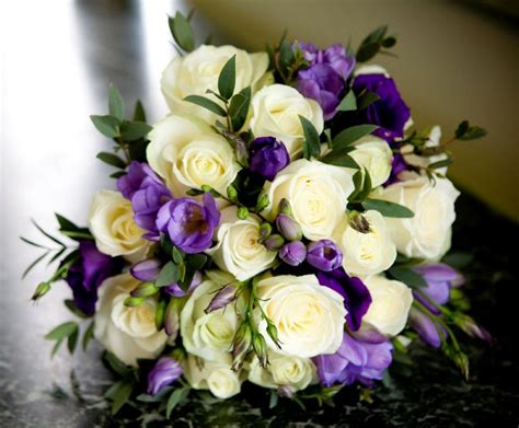 white rose lilac freesia and purple lisianthus bouquet purple wedding bouquets brides