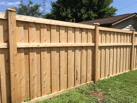 Neither posts nor rails can be seen on the outside of this fence. Wood Fence Gallery | Fence Company - CEDAR MOUNTAIN FENCE