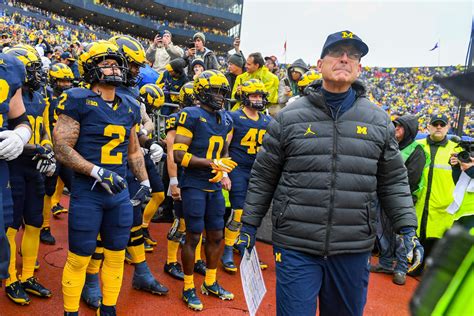 Suspended Jim Harbaugh is tainted, too, but this Michigan season should