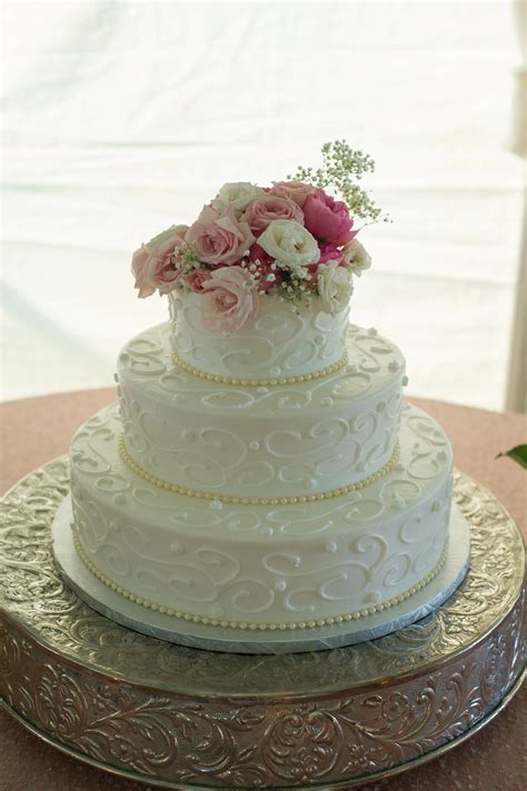 Traditional Three Tiered Wedding Cake With Pink Roses