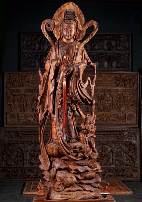 Hand Carved Wood Kwan Yin Standing On A Lotus Flower With Her Child