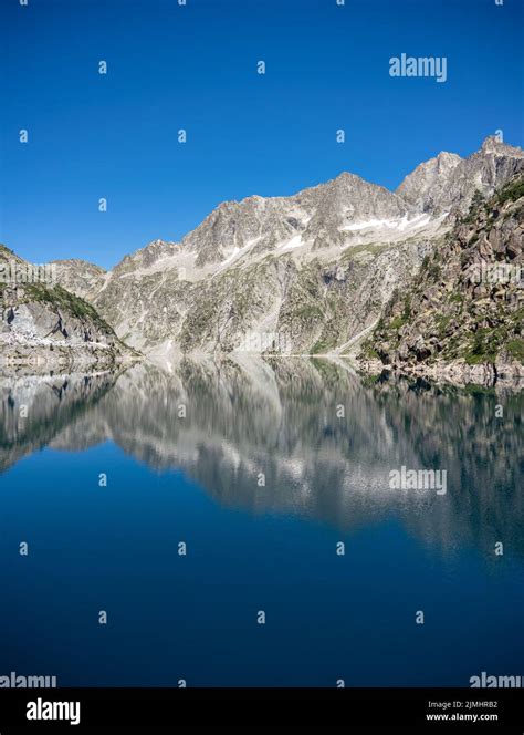 Mountain Reflection In Still Blue Water Lake Lac De Cap De Long
