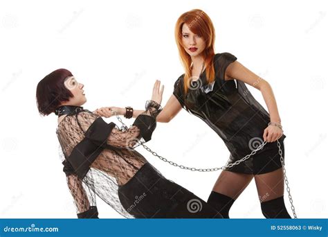 Redhead Dominatrix Keeps Chained Submissive Girl Stock Image Image Of