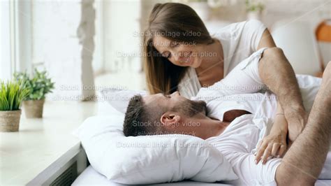 Young Beautiful And Loving Couple Wake Up At The Morning Attractive Woman Kiss And Hug His