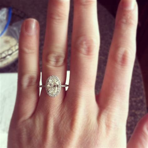 A Womans Hand With A Diamond Ring On It