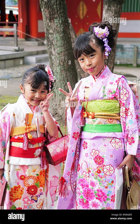 Girls Dressed Up In Traditional Kimonos Celebrating A Shichi Go San