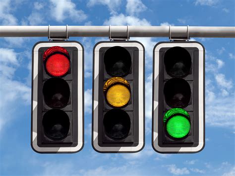 Traffic Lights Red Yellow Green Against Sky Hr Daily Advisor