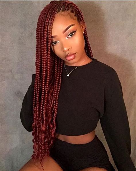 Cornrow braided hairstyles require a unique ability to braid hair close to the scalp to create cool designs and beautiful styles. The curly ends on these gorgeous red box braids give them ...
