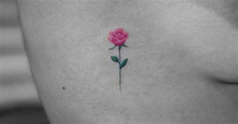 Tiny Pink Rose Tattoo On The Right Ribcage