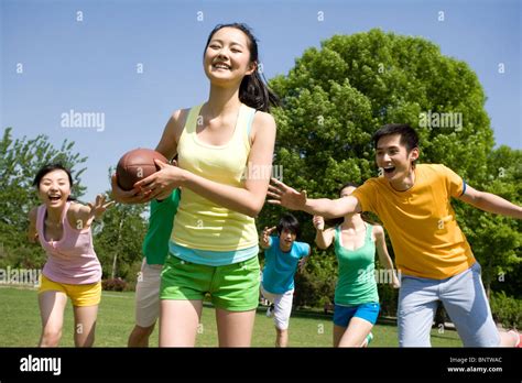 Group Of Friends Playing American Football Stock Photo Alamy