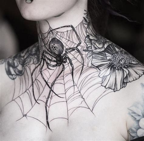 A Woman With Spider Web Tattoo On Her Chest