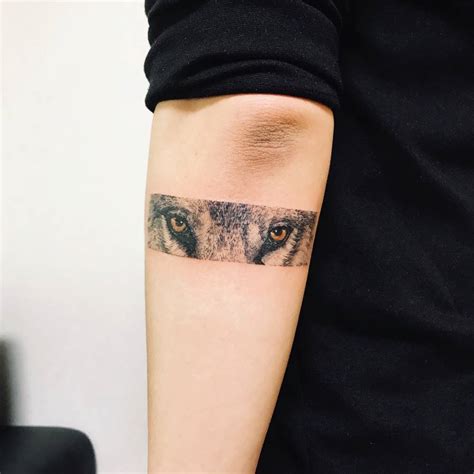 Wolf Eyes Tattoo On The Left Forearm