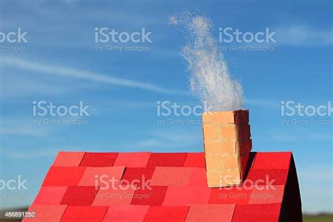 Image Of Smoking Chimney On Homemade Model House Cardboard Roof Stock