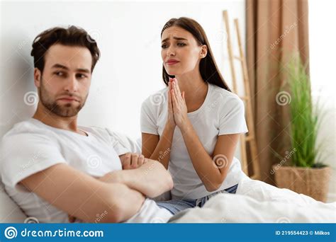 Unhappy Wife Pleading Offended Indifferent Husband For Forgiveness Indoor Stock Image Image Of