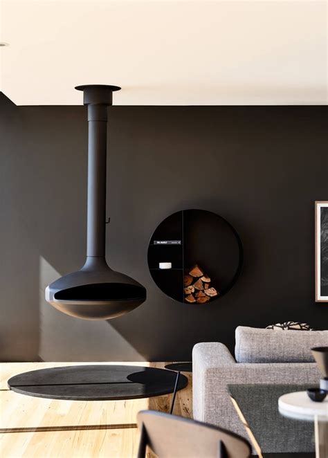 Stunning fireplace with minimalistic design hanging fireplace looks really amazing. 11 Hanging Fireplaces We Wouldn't Mind Cozying Up To | Hunker