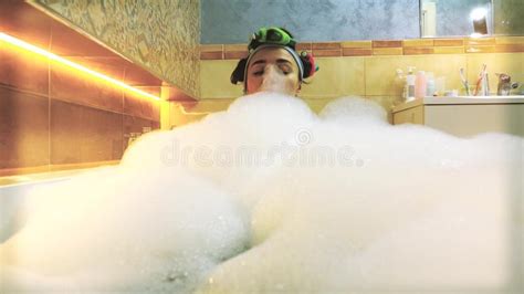 Beautiful Brunette Woman Taking Foamy Bath And Playing With Soap Foam