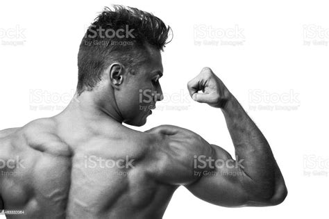 Man Flexing Muscles Rear View Stock Photo Download Image Now 20 29