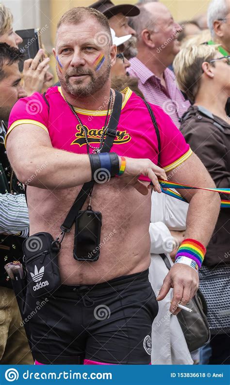 2019 a hairy man in a tight pink t shirt attending the gay pride parade also known as