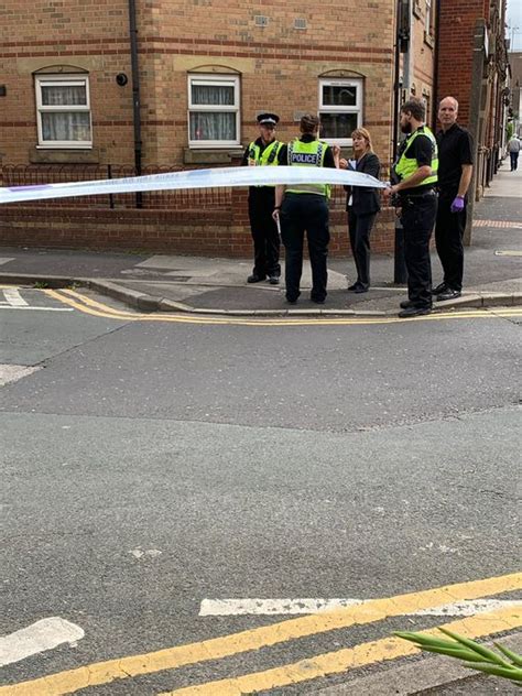 Police And Forensic Officers Cordon Off Midland Street As Man Suffers