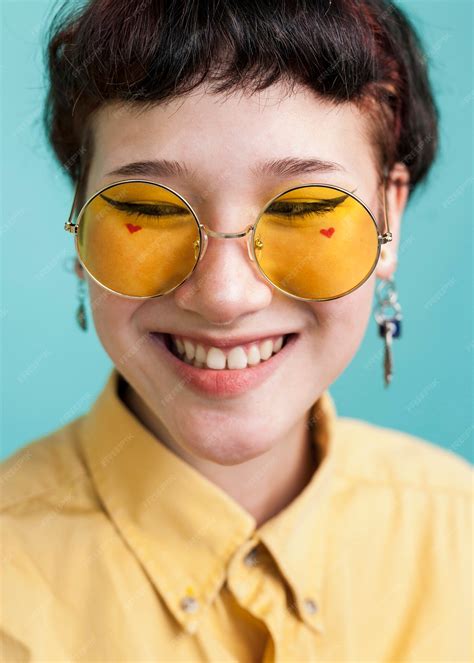Free Photo Smiling Model Wearing Yellow Glasses