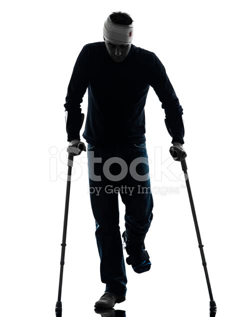 Injured Man Walking With Crutches Silhouette Stock Photo Royalty Free