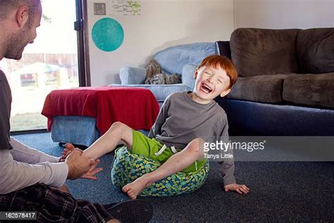 Father Tickling Son Feet Bildbanksfoton Och Bilder Getty Images