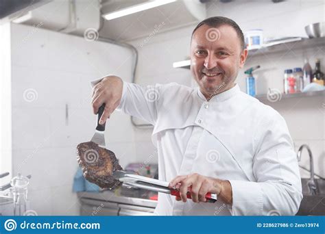 Professional Chef Working At Restaurant Kitchen Stock Photo Image Of