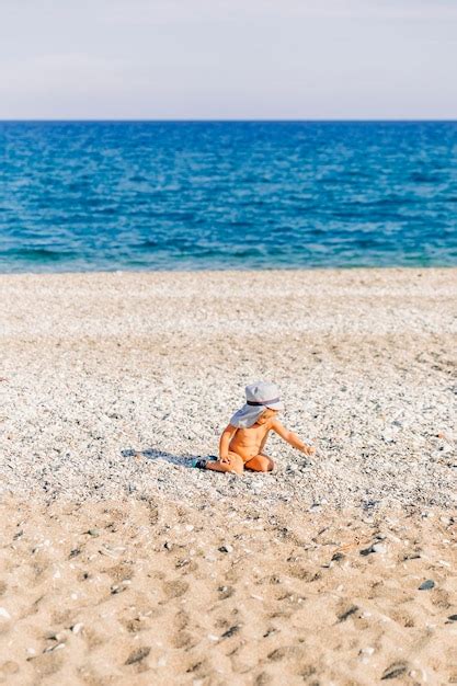 Premium Photo Shirtless Naked Girl Playing At Beach
