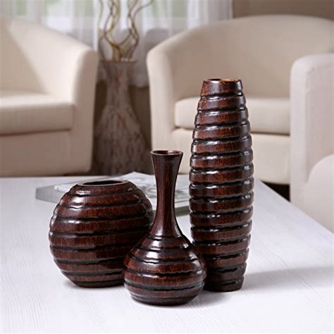 Enhance your decor with stylish floor vases, table vases, or handcrafted pieces of pottery to make your home look more inviting. Hosley's Carved Wood Vases; Small 6", Medium 8" and Tall ...