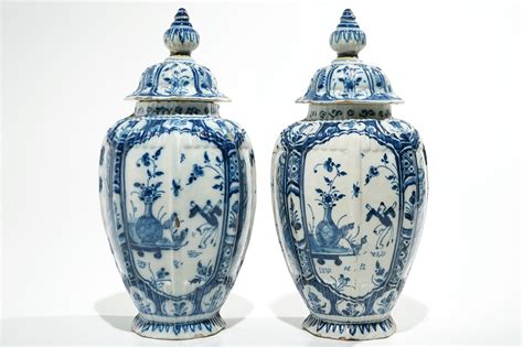 A Pair Of Dutch Delft Blue And White Chinoiserie Covered Vases 18th C