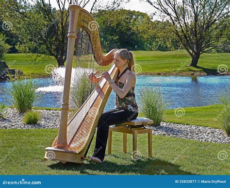 Woman Playing A Harp On A Golf Course Stock Image Image Of Outdoor