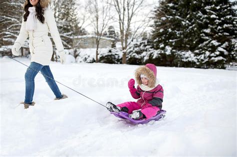 Happy Mother Pulling Sled With Child In Winter Stock Image Image Of
