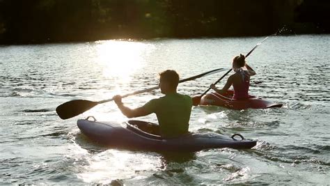 Young People Canoeing In The Lake At Sunset Stock Footage Video 4601513