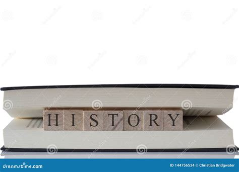 History Written On Wooden Blocks Inside A Book Isolated On A White