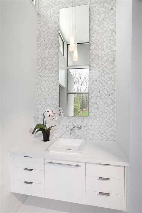 The white and silver accessories give this powder room a crisp, modern feel. powder room mirror ideas contemporary - Google Search ...
