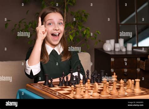 Emotional Schoolgirl Chess Player Female Teen Sitting At Chessboard
