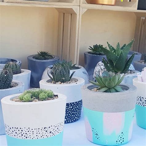 Whether you have a garden, a few fresh flowers, or a wall of plants… they all need a place to live! painted concrete planters | Diy concrete planters, Concrete plant pots, Diy planters