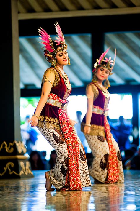 Two Women Performing A Traditional Javanese Dance At The Sultans