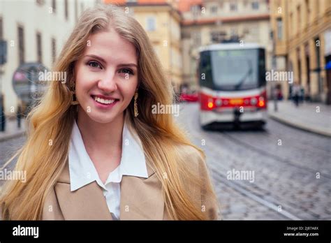Blonde Woman Stand In Bus Stop And Waiting Trolley In Prague Sity Chezh