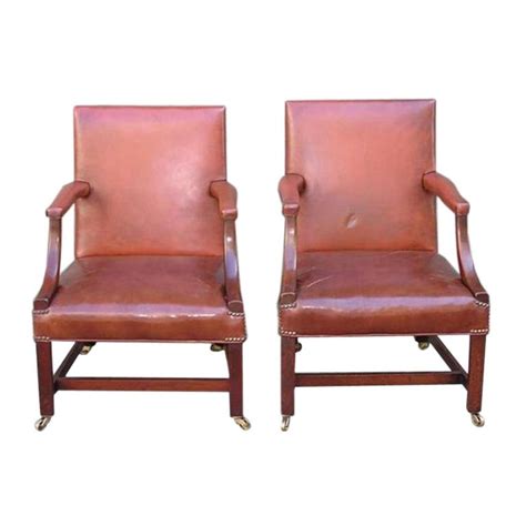 Leather chairs for your dining table are a great option that will transition through your life phases right alongside you. Pair of English Leather Arm Chairs For Sale at 1stdibs