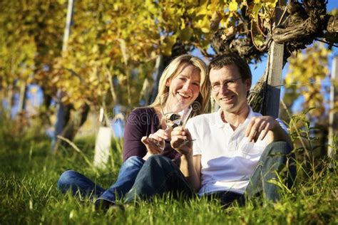 Couple Enjoying Wine In Vineyard Stock Photo Image Of Skoal Happy