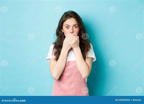 Portrait Of Shocked Glamour Girl Gasping Covering Mouth With Hands And